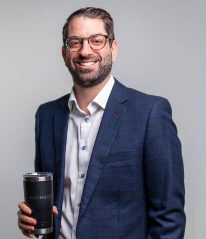 Scott Kaufman holding a coffee mug