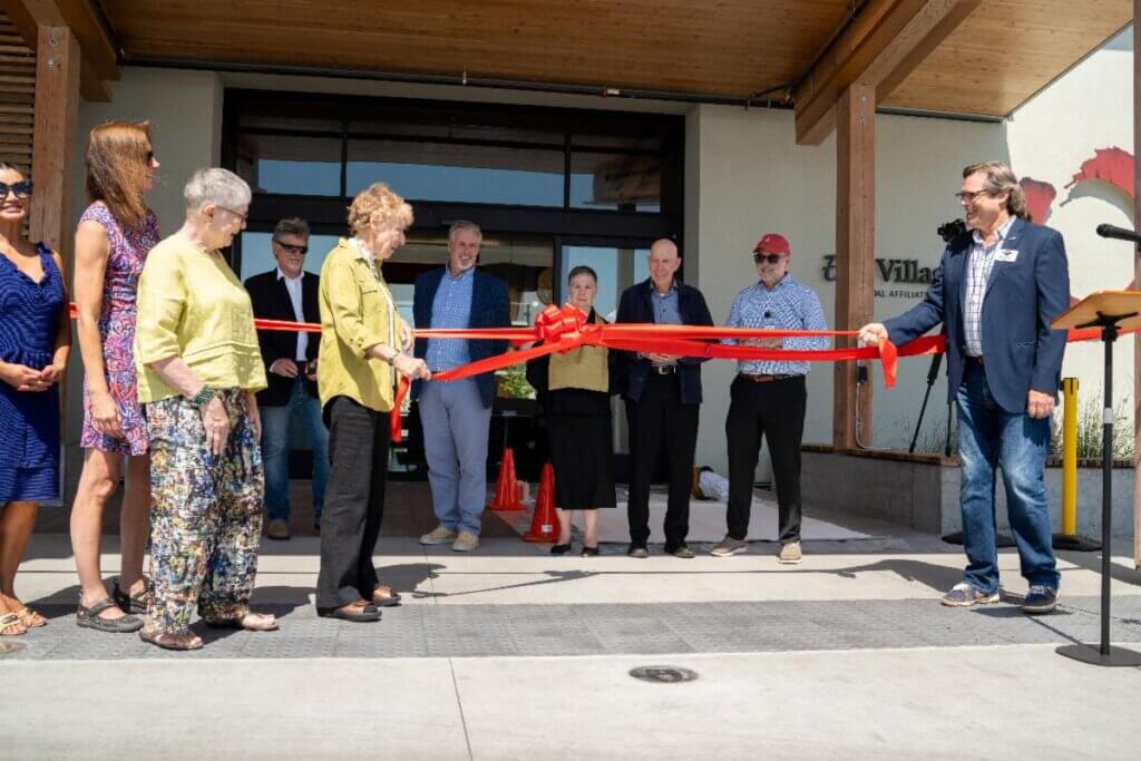 Group gathers at Enso Village for a ribbon cutting ceremony